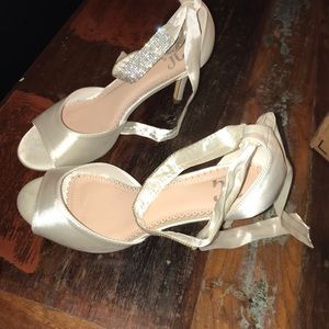 Off white pumps with jewel accent ribbon strap
